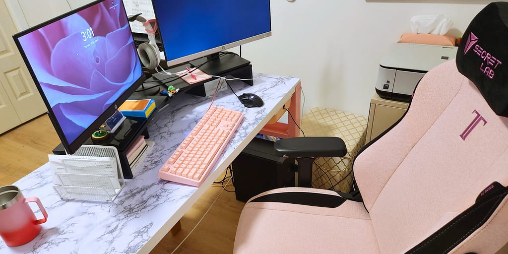 pink secret labs desk chair in home office space